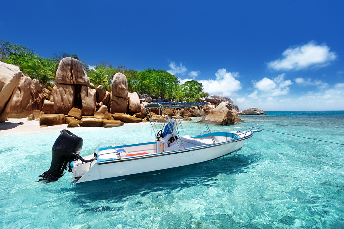 Speed Boat parked by Coco Island beach in Seychelles.